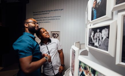 Two people viewing an exhibit at the Canadian Museum for Human Rights.